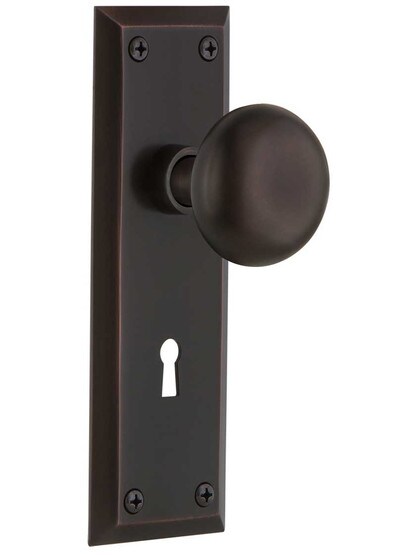 New York Style Door Set With Classic Round Knobs in Timeless Bronze.